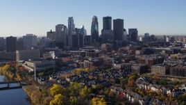 5.7K aerial stock footage of flying away from the skyline of Downtown Minneapolis, Minnesota, descend toward river Aerial Stock Footage | DX0001_002348