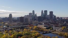 5.7K aerial stock footage ascend to reveal the river with view of the skyline, Downtown Minneapolis, Minnesota Aerial Stock Footage | DX0001_002354