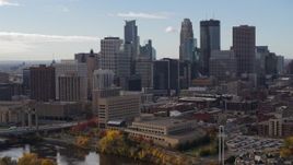 5.7K aerial stock footage of flying by the towering skyscrapers of the city skyline, Downtown Minneapolis, Minnesota Aerial Stock Footage | DX0001_002377