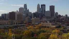 5.7K aerial stock footage fly away from and by the towering skyscrapers of the city skyline, Downtown Minneapolis, Minnesota Aerial Stock Footage | DX0001_002379
