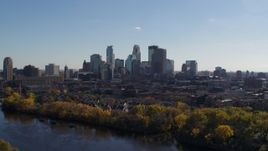 5.7K aerial stock footage reverse view of city skyline, reveal Mississippi River, Downtown Minneapolis, Minnesota Aerial Stock Footage | DX0001_002453