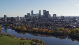 5.7K aerial stock footage wide view of the city skyline on the other side of the river, Downtown Minneapolis, Minnesota Aerial Stock Footage | DX0001_002459
