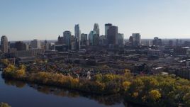 5.7K aerial stock footage wide view of the city's skyline on the other side of the river, Downtown Minneapolis, Minnesota Aerial Stock Footage | DX0001_002460