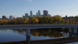 5.7K aerial stock footage approach and fly over bridge to focus on skyline of Downtown Minneapolis, Minnesota Aerial Stock Footage | DX0001_002461