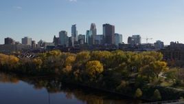 5.7K aerial stock footage flying by Mississippi River with view of skyline of Downtown Minneapolis, Minnesota Aerial Stock Footage | DX0001_002462
