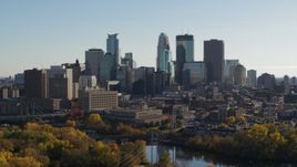 5.7K aerial stock footage focus on tall skyscrapers while ascending by the city skyline, Downtown Minneapolis, Minnesota Aerial Stock Footage | DX0001_002477