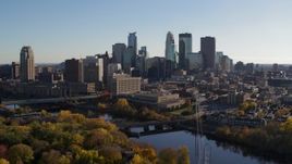 5.7K aerial stock footage reverse view of the river and the city skyline, Downtown Minneapolis, Minnesota Aerial Stock Footage | DX0001_002488