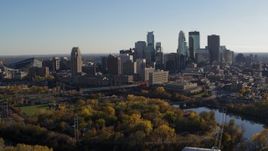5.7K aerial stock footage fly past the city skyline across the Mississippi River, Downtown Minneapolis, Minnesota Aerial Stock Footage | DX0001_002496