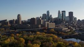 5.7K aerial stock footage fly over trees with view of city skyline, reveal Mississippi River, Downtown Minneapolis, Minnesota Aerial Stock Footage | DX0001_002500