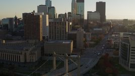 5.7K aerial stock footage ascend near Hennepin Avenue Bridge at sunset near apartment and USPS buildings, Downtown Minneapolis, Minnesota Aerial Stock Footage | DX0001_002512