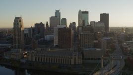 5.7K aerial stock footage flyby skyscrapers and descend by Hennepin Avenue Bridge at sunset, Downtown Minneapolis, Minnesota Aerial Stock Footage | DX0001_002513