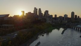 5.7K aerial stock footage of the skyline at sunset from the Mississippi River, Downtown Minneapolis, Minnesota Aerial Stock Footage | DX0001_002526