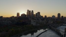 5.7K aerial stock footage of city skyline across the Mississippi River at sunset, Downtown Minneapolis, Minnesota Aerial Stock Footage | DX0001_002531