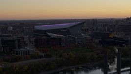 5.7K aerial stock footage of passing by US Bank Stadium at sunset, Downtown Minneapolis, Minnesota Aerial Stock Footage | DX0001_002545