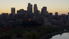 5.7K aerial stock footage of the city's skyline seen from the river at sunset, Downtown Minneapolis, Minnesota Aerial Stock Footage | DX0001_002553