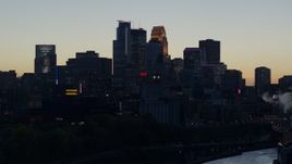 5.7K aerial stock footage slow pass of the city skyline across the river at twilight, Downtown Minneapolis, Minnesota Aerial Stock Footage | DX0001_002564