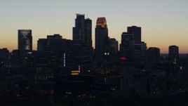 5.7K aerial stock footage ascend from power plant for view of the city skyline across the river at twilight, Downtown Minneapolis, Minnesota Aerial Stock Footage | DX0001_002567