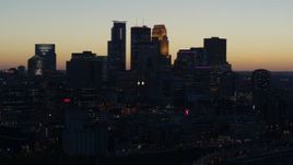 5.7K aerial stock footage of focusing on the skyscrapers in the city skyline at twilight, Downtown Minneapolis, Minnesota Aerial Stock Footage | DX0001_002570