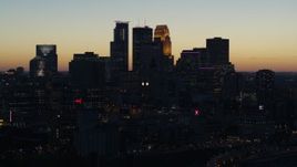 5.7K aerial stock footage flying by the skyscrapers in the city skyline at twilight, Downtown Minneapolis, Minnesota Aerial Stock Footage | DX0001_002573