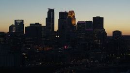 5.7K aerial stock footage of the skyscrapers in the city skyline at twilight during descent, Downtown Minneapolis, Minnesota Aerial Stock Footage | DX0001_002574