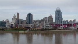 5.7K aerial stock footage ascend from Ohio River and focus on city skyline and baseball stadium, Downtown Cincinnati, Ohio Aerial Stock Footage | DX0001_002587