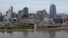 5.7K aerial stock footage of flying by city skyline and baseball stadium by Ohio River, Downtown Cincinnati, Ohio Aerial Stock Footage | DX0001_002595