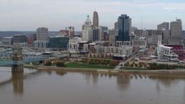 5.7K aerial stock footage descend toward river with view of city's skyline, Downtown Cincinnati, Ohio Aerial Stock Footage | DX0001_002608