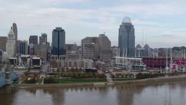 5.7K aerial stock footage ascend and flyby riverfront baseball stadium and skyline, reveal bridge, Downtown Cincinnati, Ohio Aerial Stock Footage | DX0001_002614
