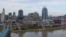 5.7K aerial stock footage passing by riverfront baseball stadium and skyline, seen from river, Downtown Cincinnati, Ohio Aerial Stock Footage | DX0001_002615