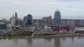 5.7K aerial stock footage reverse view of riverfront baseball stadium and skyline, Downtown Cincinnati, Ohio Aerial Stock Footage | DX0001_002617