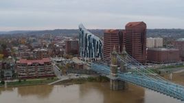 5.7K aerial stock footage of passing a condominium complex, two riverfront office buildings and bridge in Covington, Kentucky Aerial Stock Footage | DX0001_002627