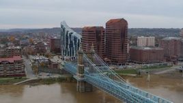 5.7K aerial stock footage of flying by a bridge for view of condo complex and two riverfront office buildings in Covington, Kentucky Aerial Stock Footage | DX0001_002629