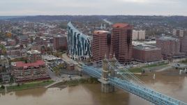 5.7K aerial stock footage flyby and reverse view of condo complex, office buildings and Roebling Bridge in Covington, Kentucky Aerial Stock Footage | DX0001_002660