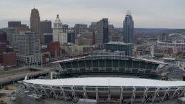 5.7K aerial stock footage flyby football stadium and focus on city skyline in Downtown Cincinnati, Ohio Aerial Stock Footage | DX0001_002674