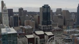 5.7K aerial stock footage of a reverse view the Scripps Center skyscraper, reveal Ferris wheel in Downtown Cincinnati, Ohio Aerial Stock Footage | DX0001_002677