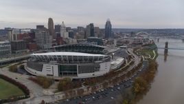 5.7K aerial stock footage reverse view of football stadium and skyline, reveal Ohio River in Downtown Cincinnati, Ohio Aerial Stock Footage | DX0001_002682