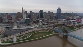 5.7K aerial stock footage flyby the city's skyline, seen from a bridge over the Ohio River in Downtown Cincinnati, Ohio Aerial Stock Footage | DX0001_002684