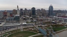 5.7K aerial stock footage approach the city's skyline from a bridge over the Ohio River in Downtown Cincinnati, Ohio Aerial Stock Footage | DX0001_002685