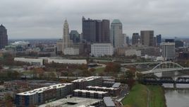 5.7K aerial stock footage ascend with view of the city's skyline, reveal the Scioto River in Downtown Columbus, Ohio Aerial Stock Footage | DX0001_002698