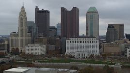5.7K aerial stock footage flying by four tall skyscrapers in the city's skyline in Downtown Columbus, Ohio Aerial Stock Footage | DX0001_002704