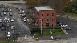 5.7K aerial stock footage ascend while approaching a brick police station in Columbus, Ohio Aerial Stock Footage | DX0001_002715