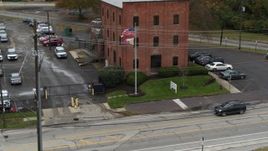 5.7K aerial stock footage descend and fly away from a brick police station in Columbus, Ohio Aerial Stock Footage | DX0001_002716