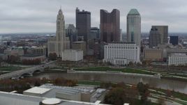 5.7K aerial stock footage of passing by the city's skyline across the Scioto River, Downtown Columbus, Ohio Aerial Stock Footage | DX0001_002719