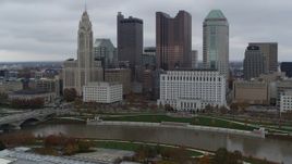 5.7K aerial stock footage of approaching the Scioto River and the city skyline, Downtown Columbus, Ohio Aerial Stock Footage | DX0001_002722