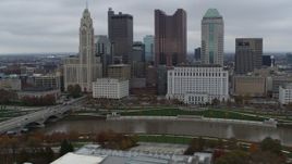 5.7K aerial stock footage of a reverse view of the Scioto River and the city skyline, Downtown Columbus, Ohio Aerial Stock Footage | DX0001_002723
