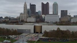 5.7K aerial stock footage descend by science museum with view of the city skyline, Downtown Columbus, Ohio Aerial Stock Footage | DX0001_002724