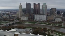5.7K aerial stock footage fly away from the city's skyline and river, hover for stationary view, Downtown Columbus, Ohio Aerial Stock Footage | DX0001_002729