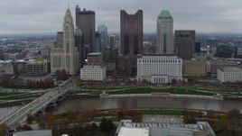 5.7K aerial stock footage passing the city's skyline and river near Discovery Bridge, Downtown Columbus, Ohio Aerial Stock Footage | DX0001_002731