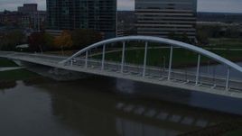 5.7K aerial stock footage of the Main Street Bridge spanning the Scioto River at sunset, Downtown Columbus, Ohio Aerial Stock Footage | DX0001_002737