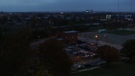 5.7K aerial stock footage of approaching a brick police station at twilight in Columbus, Ohio Aerial Stock Footage | DX0001_002764